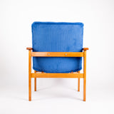 Fauteuil Wroclaw bleu côtelé de dos 